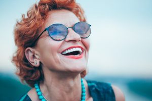 older woman smiling after receiving all-on-4